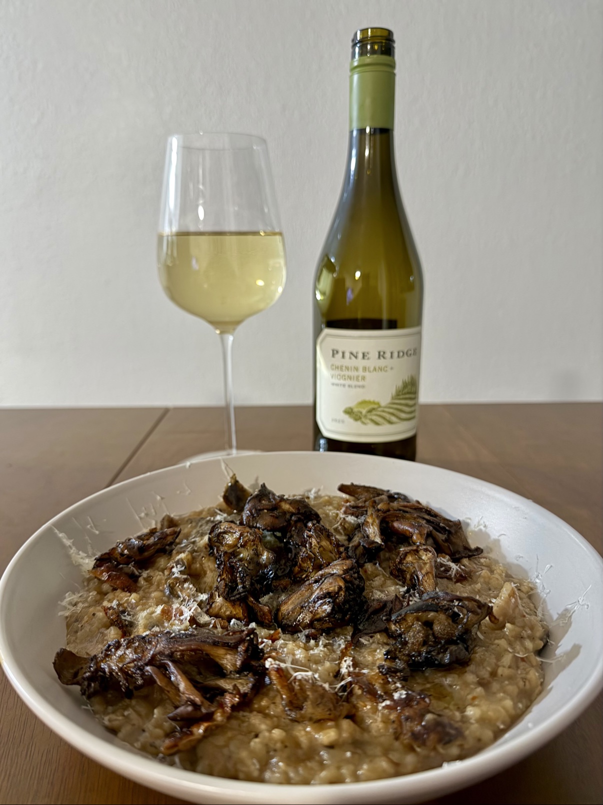 Close-up of wild mushroom risotto topped with crispy roasted maitake mushrooms